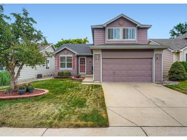 Charming two-story home with a well-manicured lawn and attached garage, offers lovely curb appeal at 3691 Bucknell Dr, Highlands Ranch, CO 80129