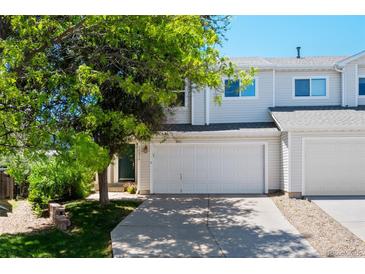 Inviting townhome with attached garage, mature shade tree and lush green lawn at 16256 E Otero Pl, Englewood, CO 80112