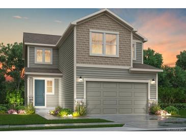 Charming two-story home with a craftsman-style garage, neutral siding, and professional landscaping at 9092 Quintero St, Commerce City, CO 80022