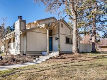 Inviting single-Gathering home featuring neutral siding, chimney, concrete steps to the front door and mature landscaping at 7970 W 90Th Ave # 115, Broomfield, CO 80021