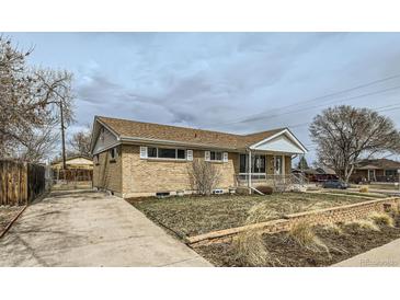 Charming brick home with a well-maintained lawn and classic design, perfect for a cozy living experience at 283 Garland Dr, Northglenn, CO 80233