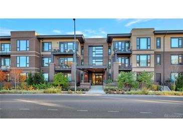 Modern condo building with attractive landscaping and convenient street access at 6618 E Lowry Blvd # 210, Denver, CO 80230