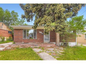 Cozy brick home featuring a mature tree in the front yard and a vintage brick porch at 4624 W Virginia Ave, Denver, CO 80219