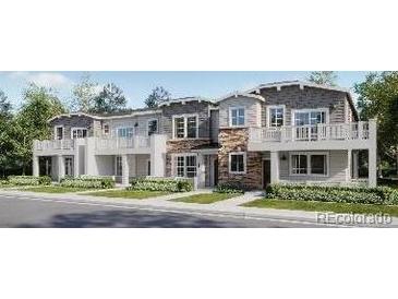 Three-story townhouses with stone accents and balconies at 8903 San Antonio St, Littleton, CO 80125