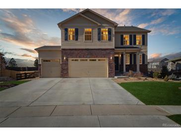 Beautiful two story home with well manicured lawn, large driveway and three car garage at 15507 Quince Cir, Thornton, CO 80602