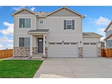 Charming two-story home with a three car garage and stone accents at 13804 Quartz St, Mead, CO 80504