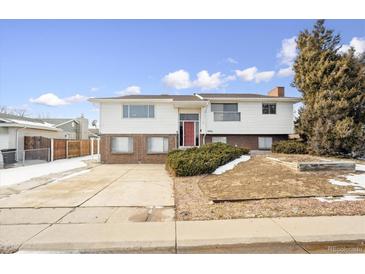 Ranch style home with attached garage and mature landscaping at 8925 Oakwood St, Westminster, CO 80031