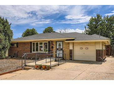 Charming brick ranch-style home featuring a well-maintained front yard and attached one car garage at 2692 S Osceola St, Denver, CO 80219