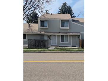 Charming townhome featuring a well-maintained front yard and freshly painted exterior at 8791 Chase Dr # 220, Arvada, CO 80003