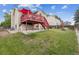 View of backyard with patio and stairs leading up to an outdoor deck at 693 Delwood Ct, Highlands Ranch, CO 80126