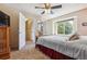 Inviting bedroom with a cozy window seat, neutral walls, and multiple entryways at 693 Delwood Ct, Highlands Ranch, CO 80126