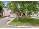 Charming home with a well-maintained front yard and two-car garage at 693 Delwood Ct, Highlands Ranch, CO 80126