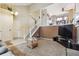 Bright living room with high ceilings, open staircase, and a cozy seating area with a glass table at 693 Delwood Ct, Highlands Ranch, CO 80126