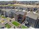 Aerial view of a residential neighborhood showcasing well-maintained homes, fenced yards, and community layout at 1914 Villageview Ln, Castle Rock, CO 80104