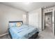 Cozy bedroom features a comfortable bed, closet, and neutral decor at 1914 Villageview Ln, Castle Rock, CO 80104