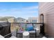 Relaxing outdoor deck with comfortable seating, pillows, and neighborhood views at 1914 Villageview Ln, Castle Rock, CO 80104