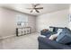 Relaxing living area with a plush sectional sofa and a stylish storage unit for organized living at 1914 Villageview Ln, Castle Rock, CO 80104