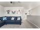 Cozy loft space featuring a comfortable blue sofa and whimsical animal artwork at 1914 Villageview Ln, Castle Rock, CO 80104