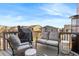 Inviting outdoor patio with comfortable seating, grill, and a view of the neighborhood at 1914 Villageview Ln, Castle Rock, CO 80104