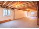 Large unfinished basement featuring an egress window, concrete floor, and insulated walls offering ample potential at 13661 Adams St, Thornton, CO 80602