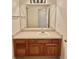 Bathroom featuring a wood vanity with a large mirror, bright lighting, and access to the shower/tub at 13661 Adams St, Thornton, CO 80602