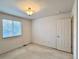 A comfortable bedroom with plush carpeting, neutral paint, and a window overlooking the neighborhood at 13661 Adams St, Thornton, CO 80602