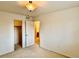 Spacious bedroom featuring plush carpeting, standard lighting, and access to a closet and bathroom at 13661 Adams St, Thornton, CO 80602