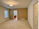 Neutral bedroom featuring carpet, large window, and a walk-in closet at 13661 Adams St, Thornton, CO 80602