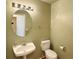 A clean, well-lit powder room with a pedestal sink and neutral paint at 13661 Adams St, Thornton, CO 80602