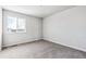 Bedroom featuring neutral carpet, base trim, white walls, a window with exterior view and several electrical outlets at 5742 Ranch St, Mead, CO 80504