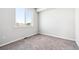 Cozy bedroom with neutral carpet, a window for natural light, and a simple, comfortable design at 5742 Ranch St, Mead, CO 80504