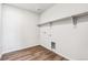 Laundry room featuring vinyl floors, shelving, white walls, base trim and washer and dryer hookups at 5742 Ranch St, Mead, CO 80504