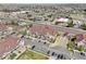 Aerial view showcases the neighborhood featuring townhomes, commercial areas, and roadways at 12711 Colorado Blvd # 1009, Thornton, CO 80241