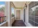 Covered balcony with exterior door, tile floor and railing at 12711 Colorado Blvd # 1009, Thornton, CO 80241