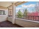 Balcony featuring brick flooring and serene views of blooming trees and clear skies at 12711 Colorado Blvd # 1009, Thornton, CO 80241