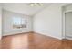 Cozy bedroom featuring hardwood floors and a bright window at 12711 Colorado Blvd # 1009, Thornton, CO 80241