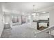 Bright, open living room with view of stainless kitchen and outdoor patio access at 12711 Colorado Blvd # 1009, Thornton, CO 80241