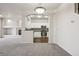 Open concept living space with kitchen and living room featuring stainless appliances at 12711 Colorado Blvd # 1009, Thornton, CO 80241