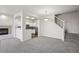Inviting living area featuring neutral tones, plush carpeting, a fireplace, and seamless open-concept design at 12711 Colorado Blvd # 1009, Thornton, CO 80241