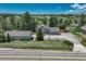 Scenic aerial view of a charming home with well-maintained landscaping and a spacious driveway at 10534 Inspiration Dr, Parker, CO 80138