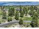 High angle aerial shot showcases a home nestled in a treed community, offering a sense of community at 10534 Inspiration Dr, Parker, CO 80138