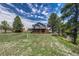 Expansive backyard with mature trees and well-maintained lawn offers plenty of space at 10534 Inspiration Dr, Parker, CO 80138