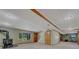 Spacious finished basement with carpet, windows, and wood-burning stove at 10534 Inspiration Dr, Parker, CO 80138