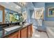 Modern bathroom features granite countertops, new fixtures, and tile flooring at 10534 Inspiration Dr, Parker, CO 80138