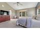 Bedroom boasts vaulted ceiling, large window, and carpeted floors at 10534 Inspiration Dr, Parker, CO 80138