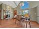 Dining room features an open floor plan, natural light, and beautiful hardwood floors at 10534 Inspiration Dr, Parker, CO 80138