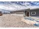 Detached garage with a gravel driveway and three bays with doors at 10534 Inspiration Dr, Parker, CO 80138
