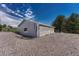Detached garage with three bays, gravel driveway and ample parking at 10534 Inspiration Dr, Parker, CO 80138