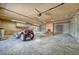 Large garage with storage and multiple bays, perfect for projects and vehicles at 10534 Inspiration Dr, Parker, CO 80138