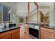 Open-concept kitchen seamlessly blending with the living area, featuring wood cabinets and a modern stovetop at 10534 Inspiration Dr, Parker, CO 80138
